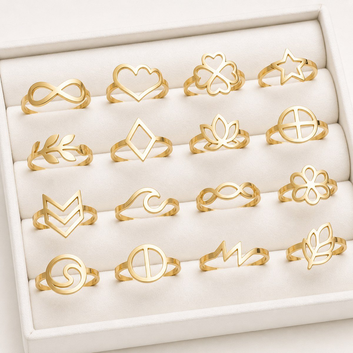 Gold laser-cut stainless steel rings with assorted flat openwork designs